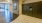 The mail room at our apartments in Arlington, featuring grey metal lock boxes and a view of a nearby entrance.