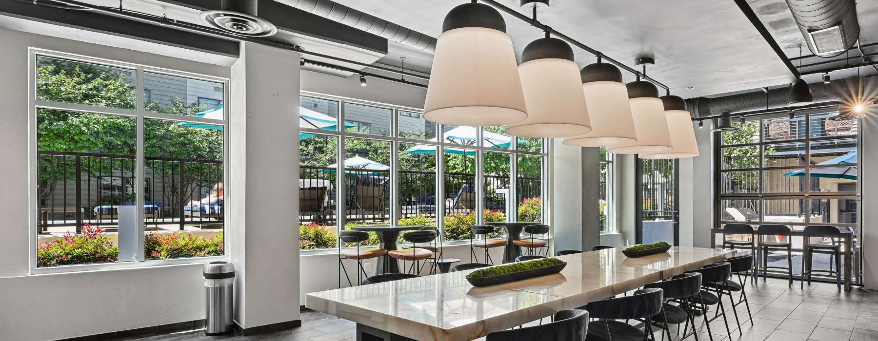 Modern resident lounge and clubroom with luxury seating at Centro Arlington