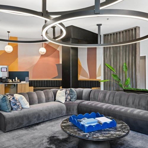 Modern resident lounge and clubroom with luxury seating at Centro Arlington